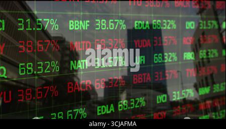 Displaying digital stock ticker over downtown via window, showing skyscrapers and tree reflections Stock Photo