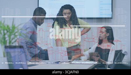 Collaborating three professionals wearing suits reviewing reports at conference table with laptop Stock Photo