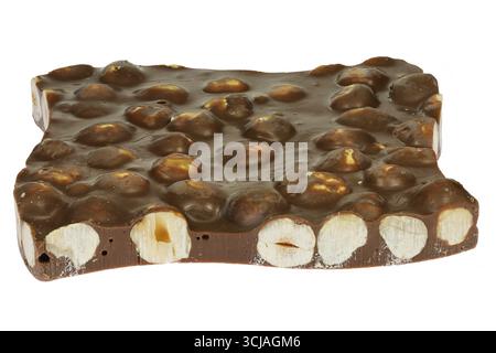 handmade broken chocolate with hazelnuts isolated on white background Stock Photo