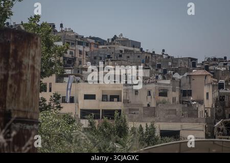 Tulkarem, Palestine. 23rd July, 2025. An Israeli flag hangs from a building in Nur Shams camp which is being occupied by the Israeli military. Tens of thousands of Palestinians were displaced by the Israeli 'Iron Wall' military offensive in early 2025 which targeted refugee camps in cities. (Photo by Sally Hayden/SOPA Images/Sipa USA) Credit: Sipa USA/17�Թ����� Live News Stock Photo