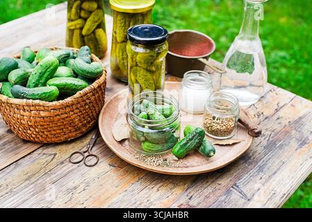 Pickled cucumbers in glass jar from home garden. Homemade cucumber pickles Stock Photo