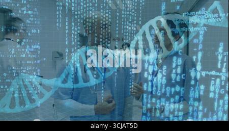 Two doctors wearing scrubs analyzing data in hospital corridor with stethoscopes DNA code overlays Stock Photo