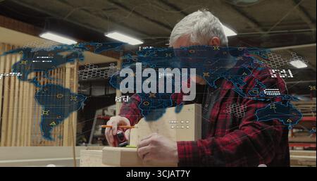 Marking wood plank, carpenter using tape measure and pencil at carpentry shop, digital map overlay Stock Photo