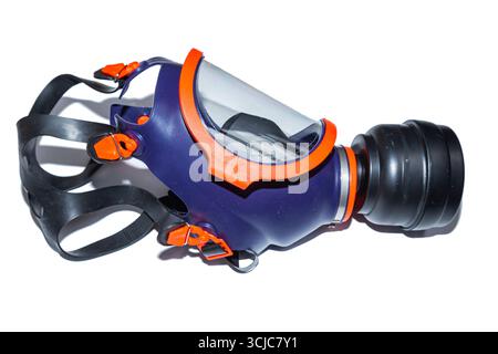 Protective face respirator mask with protective glass and replaceable filter, on a white background. Gas mask on a white background. Stock Photo