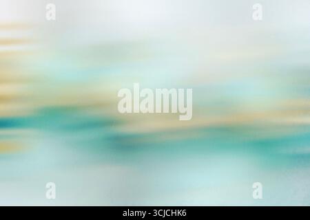A soothing abstract image with a motion blur effect, featuring soft shades of blue and beige. This artistic texture evokes a sense of calm and creativ Stock Photo