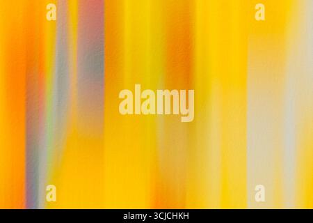 This vibrant abstract image features a dynamic motion blur effect with striking yellow and orange hues, creating an energetic and warm atmosphere perf Stock Photo