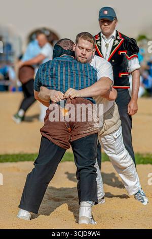 Swiss wrestlers fighting at the NOS 2012 in Silvaplana, Switzerland Stock Photo