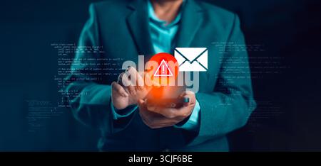 Businessman using smartphone with email phishing warning icon on virtual screen, concept of cybersecurity threat, online scam, data protection, malwar Stock Photo