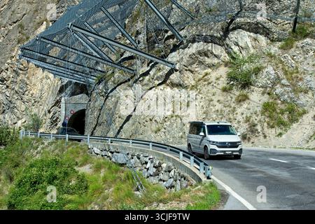 Safety nets on the rock face at the exit of the Petits Pontis tunnel protect road traffic against rockfall, Val d'Anniviers, Valais, Switzerland Stock Photo