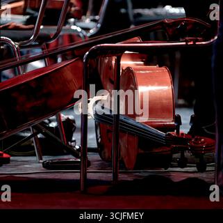 An image of a cello lies during intermission on the theater stage Stock Photo