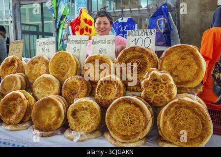 SHYMKENT, KAZAKHSTAN - JULY 19: Woman selling typical central asian ...