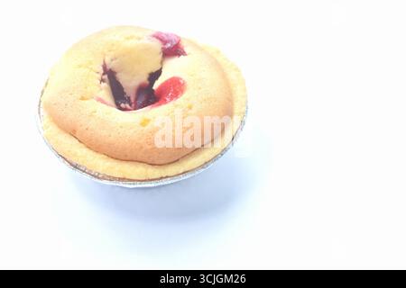 butter cake filling strawberry jam in aluminum tray on white background Stock Photo