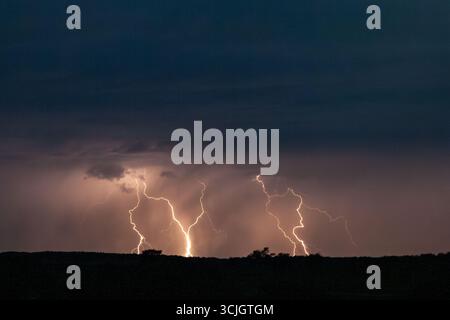 Powerful lighting strikes, thunder and storm in Kgalagadi National Park in South Africa Stock Photo