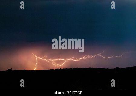Powerful lighting strikes, thunder and storm in Kgalagadi National Park in South Africa Stock Photo