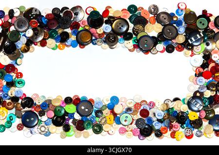 Multi-colored buttons on a white background close-up. Stock Photo