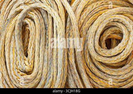 Twisted old synthetic ship's mooring rope, close-up. Stock Photo
