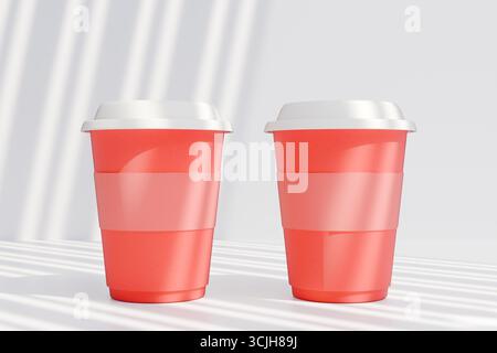 Two vibrant red paper coffee cups with white lids, perfect for holiday festivities and gatherings. 3d rendering Stock Photo