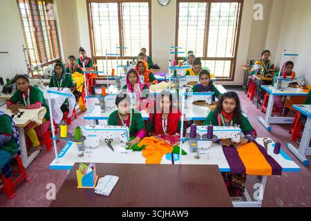 Bangladesh – May 21, 2019: In the vocational training lab, some students are learning sewing through sewing machine training in the Chuadanga district Stock Photo