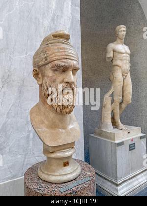 A stone statue of a bearded man wearing robes at Haedong Yonggung ...