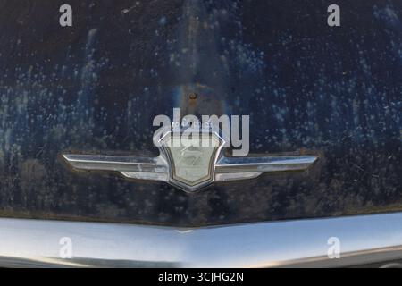 Wroclaw, Poland - August 28 2025: Weathered front badge of vintage Soviet GAZ Volga car Stock Photo