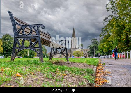 Bench in a park, Witney, Oxfordshire, Uk Stock Photo