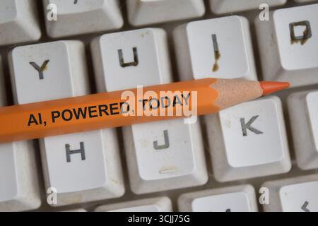 Ai powered today on pencil with keyboard background Stock Photo