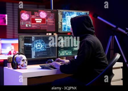 Hacker seeing critical error warning while stealing data from enterprise networks using AI software. Evil man targeting company servers getting cyber attack rejected alert popup on monitor Stock Photo