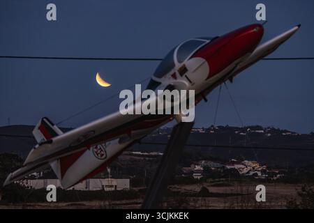 Lisbon, Portugal. 07th Sep, 2025. A red full moon, also known as a blood moon, is seen during a lunar eclipse over an aircraft placed as a monument at Air Base No. 1 in Sintra. Credit: SOPA Images Limited/Ģ����ý Live News Stock Photo
