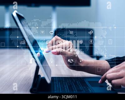 Business hand touching AI icon on digital tablet screen, artificial intelligence technology for smart automation, data analysis, digital transformatio Stock Photo