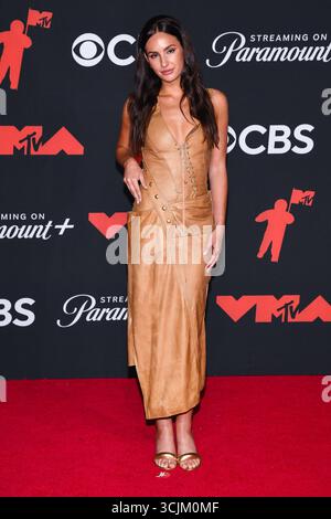 Ashtin Earle walking on the red carpet at the 2025 CFDA Fashion Awards