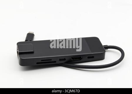 A sleek black Lemorele USB-C hub with multiple ports including HDMI isolated on white background. Stock Photo