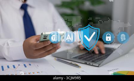 Businessman using smartphone and laptop with AI technology icons for cybersecurity, data protection, and secure online communication in modern busines Stock Photo