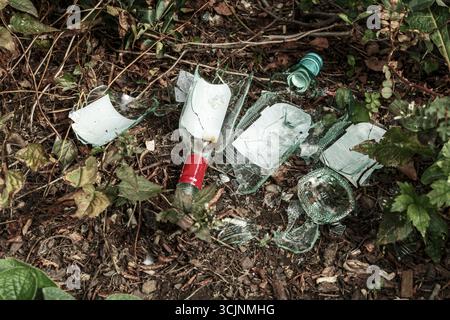 London, England - Discarded broken bottles on the towpath of the Regents Canal in London. Stock Photo