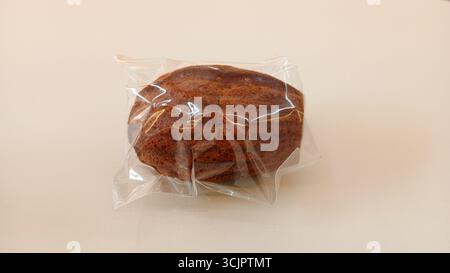 Madeleine cookies in clear plastic packaging on a white background Stock Photo