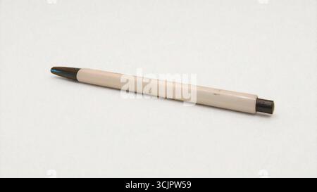 A ballpoint pen on a white table Stock Photo