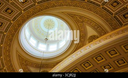 Ornate dome ceiling of the National Statuary Hall in the United States Capitol, Washington D.C., with neoclassical gold detailing. Stock Photo