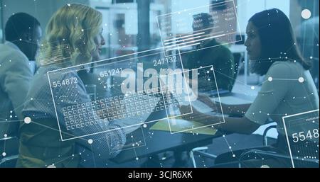 Collaborating women analyzing documents on laptops at office table with holographic overlays Stock Photo
