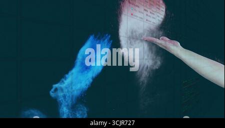 Extending right hand displaying blue-white plumes against monitor grid in control room, copy space Stock Photo