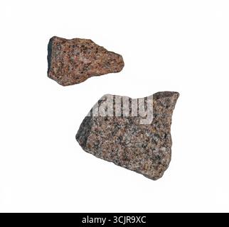Two pieces of granite stones flying isolated on white, clipping path, PNG Stock Photo
