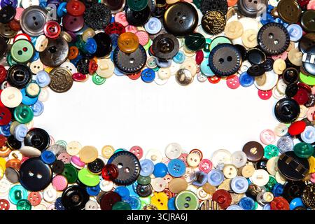 Multi-colored buttons on a white background close-up. Stock Photo