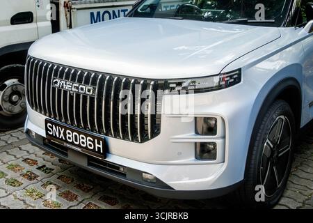 Close-up of the front of a white Jaecoo 7 electric SUV parked on a paved surface with a visible license plate chinese car brand singapore asia Stock Photo