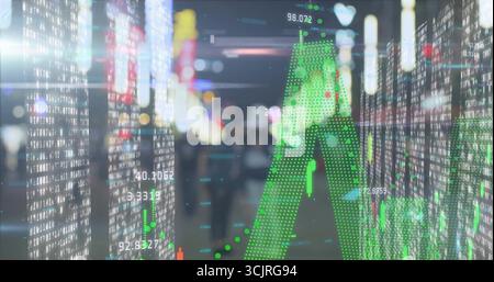 Projecting green dotted arrow over stock market data on night city street with candlestick bars Stock Photo