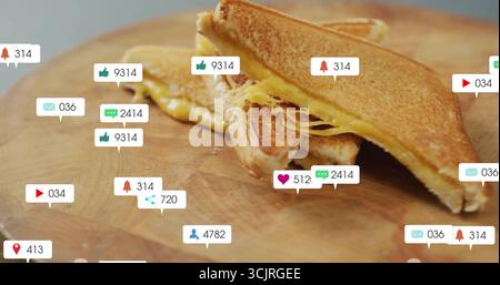 Showing grilled cheese sandwich halves stacking on cutting board with floating social media icons Stock Photo