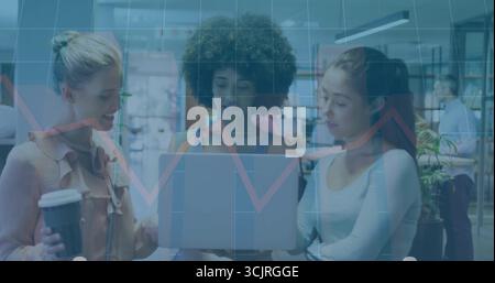 Reviewing data three coworkers analyzing laptop screen in modern office, with overlaid graph grid Stock Photo