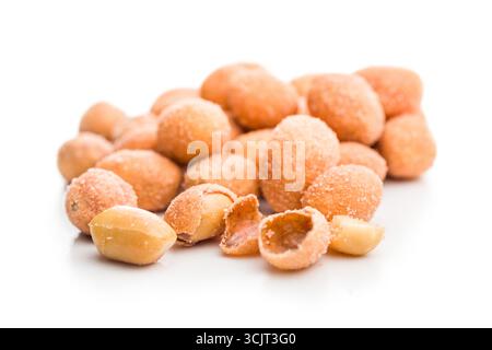 Peanuts in a crispy crust isolated on a white background. Stock Photo