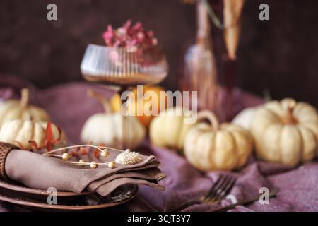 Rustic fall tablescape with pumpkins and seasonal decor Stock Photo