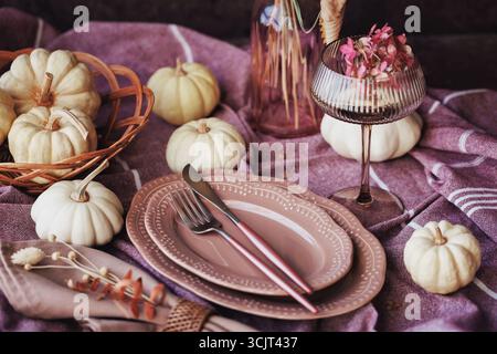 Warm fall tablescape with pumpkins and vintage accents Stock Photo