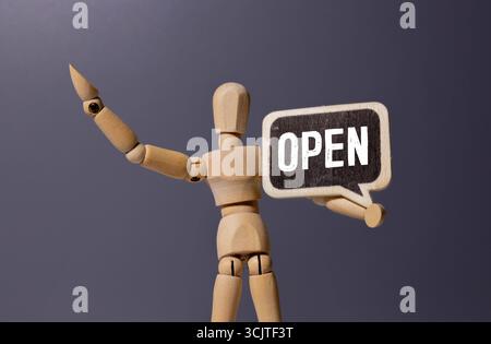 Open, sign and person at window of cafe for small business, information and start of service. Coffee shop, hospitality and waiter with board by glass Stock Photo