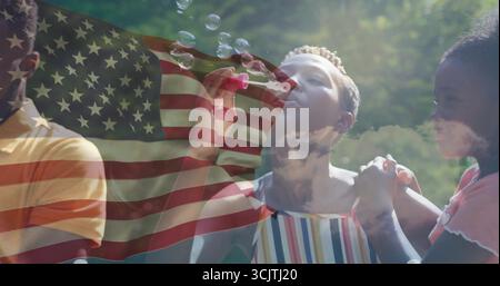 Blowing woman wearing striped top creating soap bubbles at park, with bubble wand and flag overlay Stock Photo