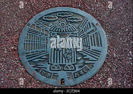 Japanese artistic manhole cover in Seki-juku (関町), the preserved 47th post town along the old Tokaido road in Seki-cho, Mie Prefecture, Japan. Stock Photo